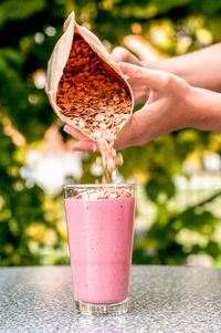 Close-up of hand holding drink