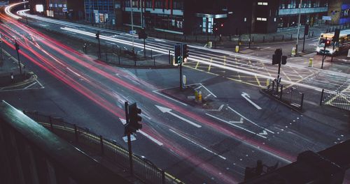 High angle view of light trails on road in city