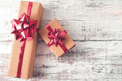 Directly above shot of christmas presents on wooden table