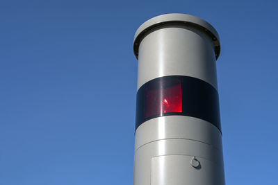 Low angle view of lighthouse against clear blue sky