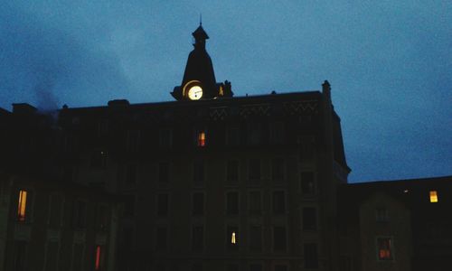 Low angle view of illuminated building against sky