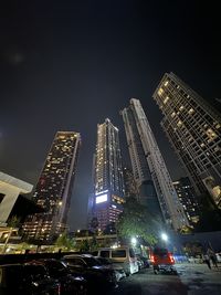 High angle view of illuminated buildings in city at night