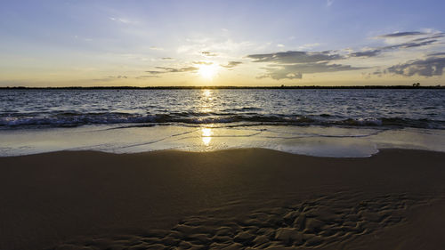 Scenic view of sea against sky during sunset