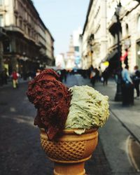 Close-up of ice cream against street