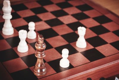 Close-up of chess pieces on floor