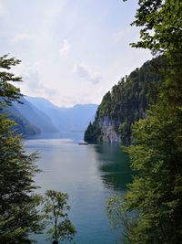 Scenic view of lake and mountains against sky