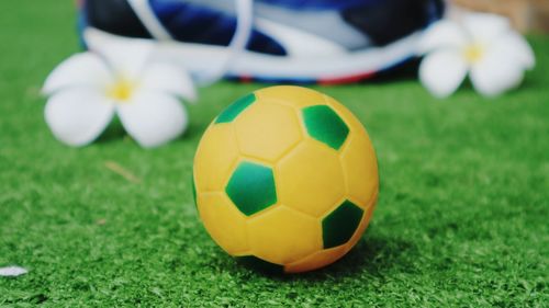 Close-up of soccer ball on field