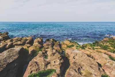 Scenic view of sea against blue sky