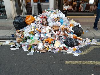 Group of people in front of garbage