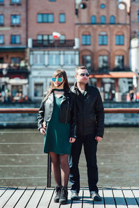 Portrait of young woman wearing sunglasses outdoors