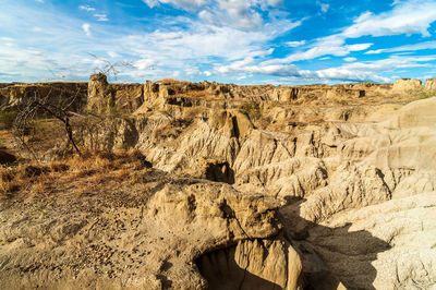 Scenic shot of rock formations at tatacoa desert against sky