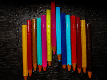 Close-up of multi colored pencils on table