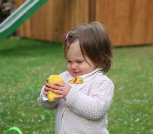 Cute girl eating food outdoors