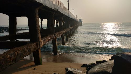 Pier over sea against clear sky