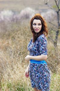 Young woman standing on field