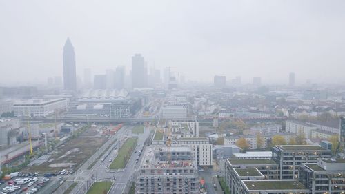 High angle view of buildings in city against sky