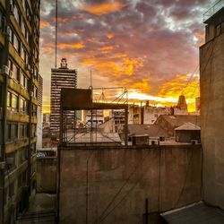 Buildings against sky during sunset