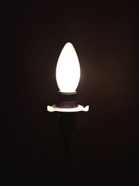 Close-up of illuminated light bulb