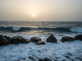 Scenic view of sea against sky during sunset