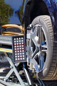 The car stands on a stand with wheel camber sensors. equipment for car wheel alignment on a stand. 