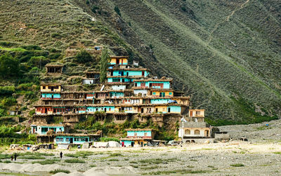 High angle view of houses and trees on landscape