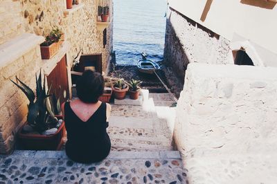 Woman standing against wall