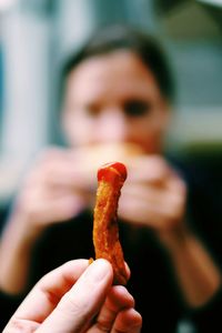 Close-up of hand holding food