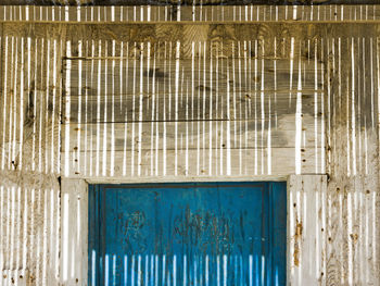 Shadow cast on the facade of a wooden cabin in almeria, spain