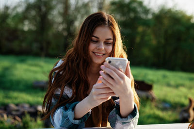 Young woman using mobile phone