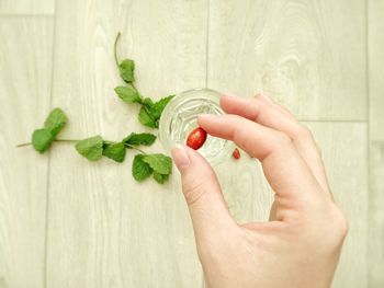 Close-up of hand holding pill