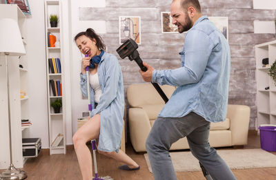 Young couple kissing at home