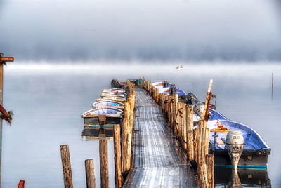 Pier over sea against sky