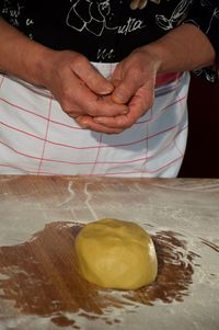 Close-up of man preparing food