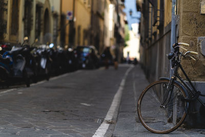 Bicycles parked on street in city