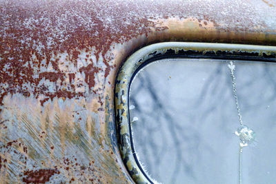 Close-up of rusty car on snow