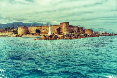 Scenic view of sea against cloudy sky