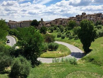Buildings against cloudy sky