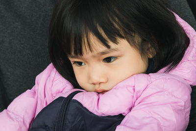 Close-up portrait of cute girl at home