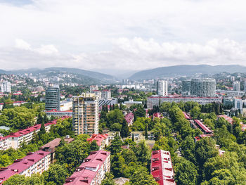 High angle view of buildings in city against sky