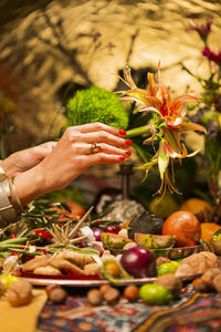 Midsection of person holding fruits