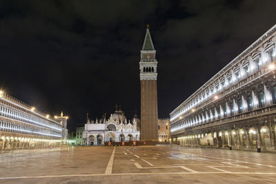 Illuminated buildings in city at night