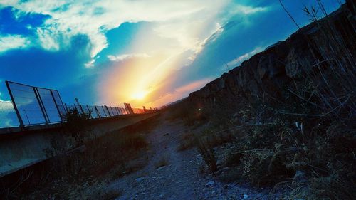 Scenic view of road against sky during sunset