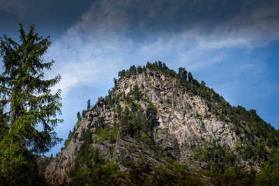 Low angle view of rock formations against sky