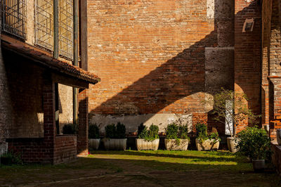 View of the cloister of an ancient red brick building in the historic center of cremona italy