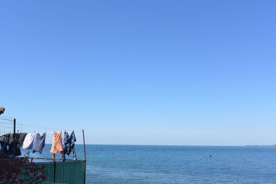 Scenic view of sea against clear blue sky