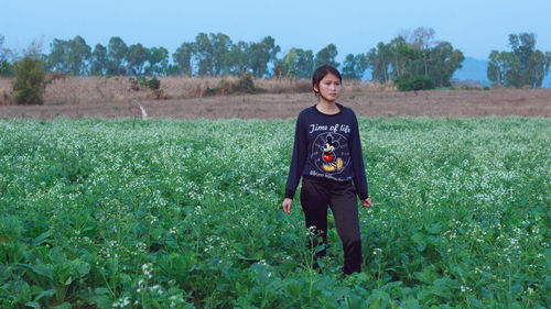 People walking on grassy field