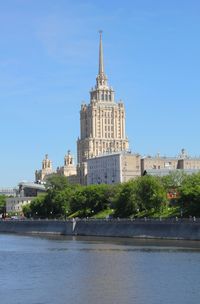 View of buildings against blue sky