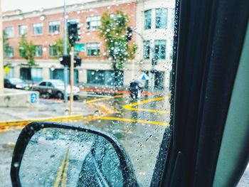 City seen through wet glass window