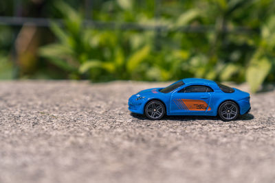 Close-up of toy car on road