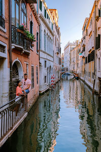 Panoramic view of canal amidst buildings